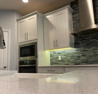 Clean kitchen with balcony and cabinet